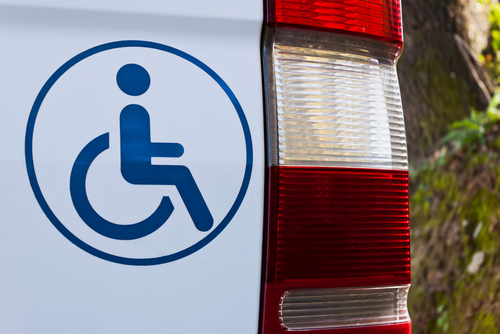 Accessible,Vehicle,Sign,On,White,Van